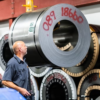 Man working in metal manufacturing company