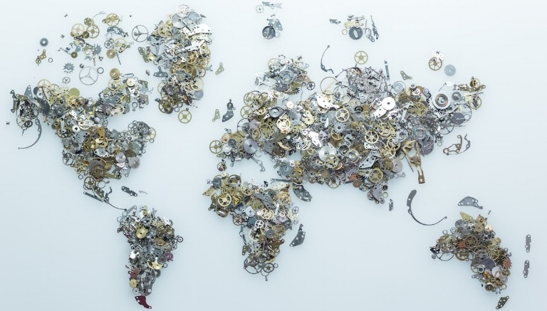 world map made out of small metal elements