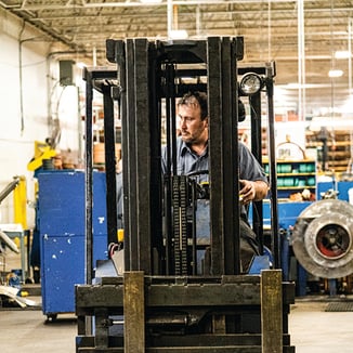 Mead employee operating a fork lift