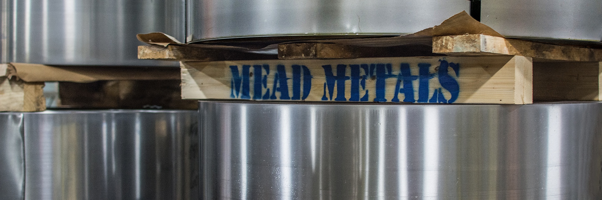 Stainless steel with wood Mead Metals sign in the middle