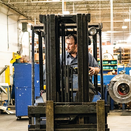employee driving a forklift